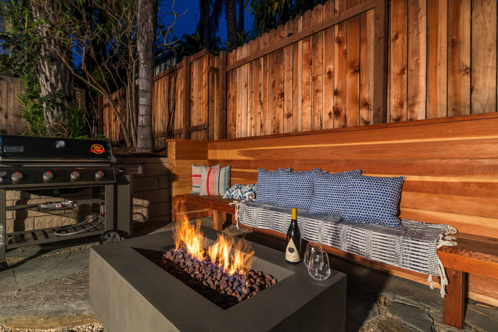 Enjoy a glass of your favorite wine next to the fire table.