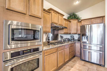 Chef will love working in fully stocked, contemporary kitchen with space for preparing and serving delectable cuisine.
