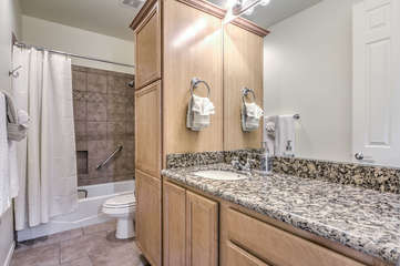 Second bathroom on the main floor has a tub-shower combination and is shared between Bedrooms 2, 3 and 4.