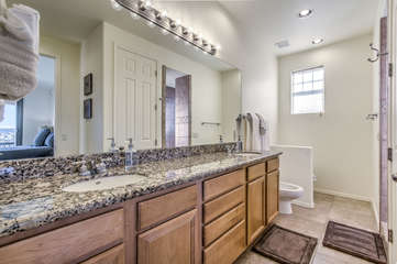 Primary bath includes dual vanity sinks, a walk-in shower and bidet.