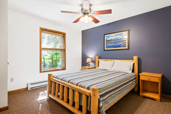 blue bedroom with single bed and ceiling fan
