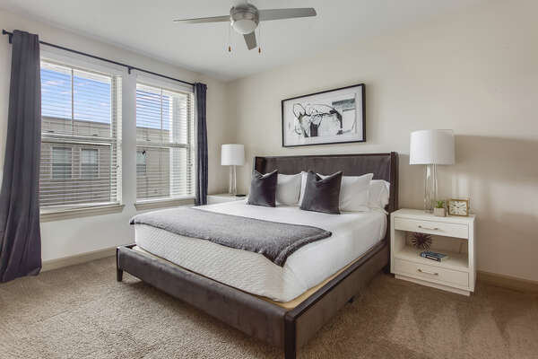 Bedroom at this Atlanta Rental Apartment with ceiling fan and nearby nightstand