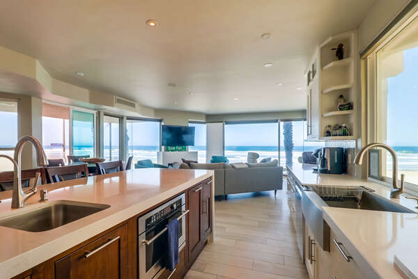 Kitchen with modern appliances and a view into the living area.