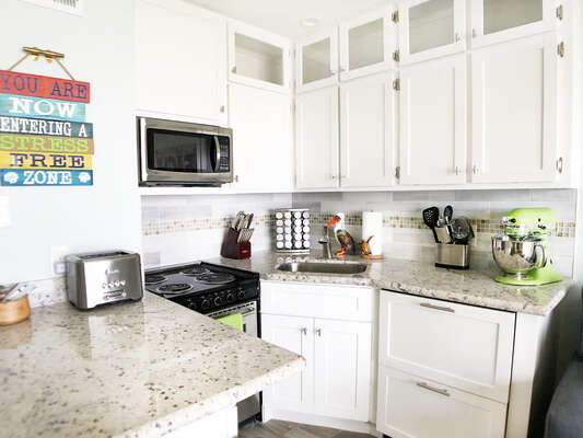 This upgraded, remodeled kitchen features everything you need to make your stay above any other stay!  KitchenAid Stand Mixer, Spice Rack, Stainless Steel appliances!