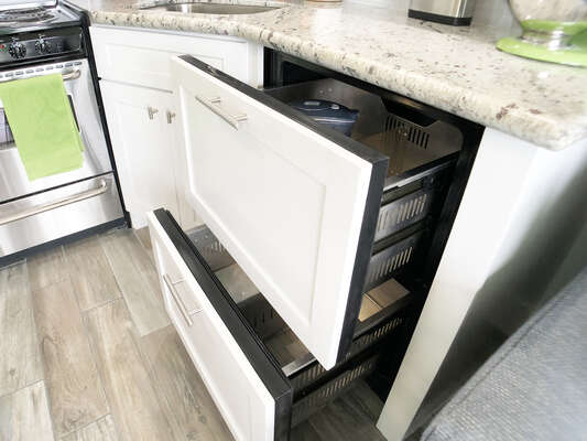 The undermount refrigerator/freezer includes a Brita Water pitcher and the freezer includes an ice-maker!!  This was designed so that you have more counter space to do all of your cooking!!