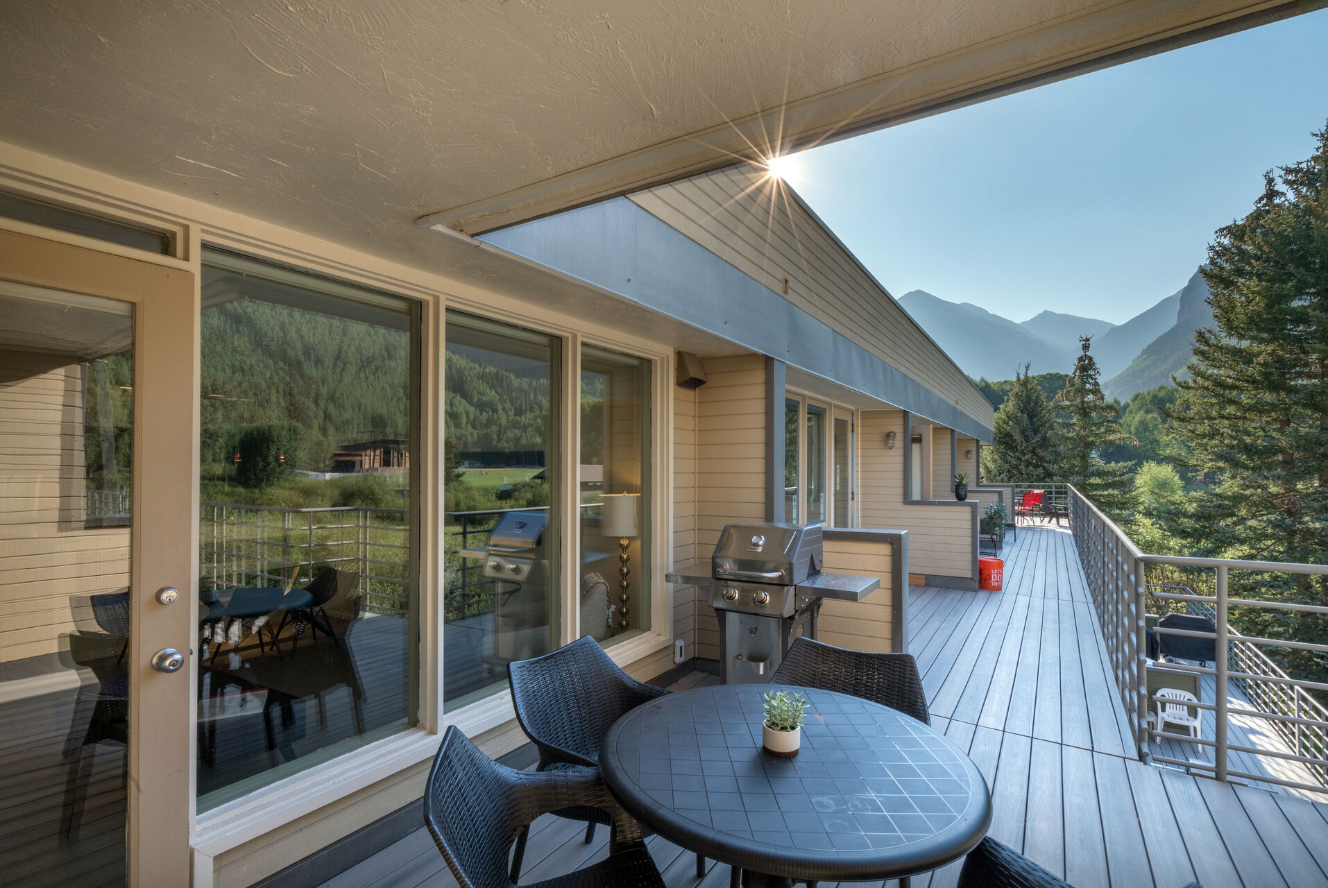 This Deck outside of this Telluride Mountain rental features seating and grill.