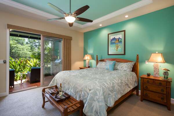 Bedroom with Access to the Private Lanai, Large Bed, and Ceiling Fan