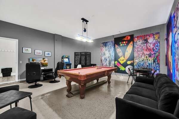 Hours of entertainment await in the garage game room. Challenge your friends or family to a round of pool.