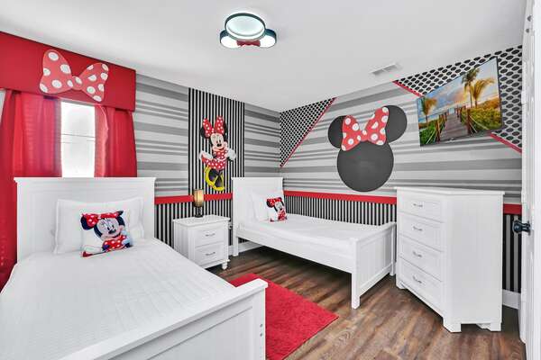 This fun kids bedroom features two twin beds