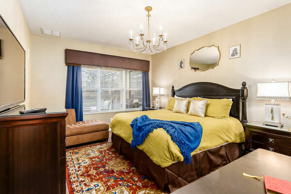 The downstairs master bedroom features a king bed and en-suite bathroom