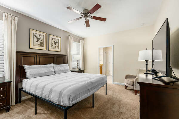 This upstairs bedroom features contemporary design and a comfortable King bed