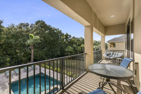Unwind on your private balcony overlooking the pool