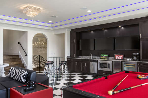 The games room has a wetbar, wine cooler and microwave so you don`t miss a single moment of the big game