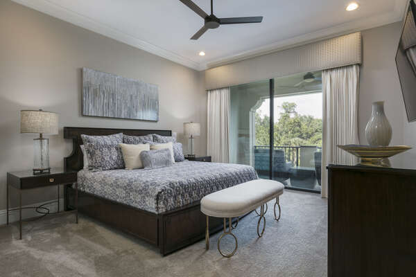 Master suite has a king size bed and access to the patio balcony