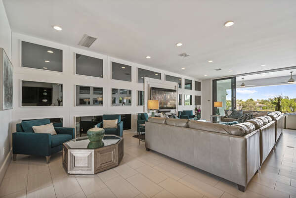 Open living area with access to the pool deck