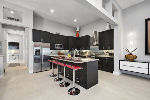 The spacious kitchen features stainless steel appliances