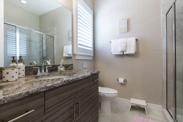 There is an ensuite bathroom with glass walk-in shower for the princess room