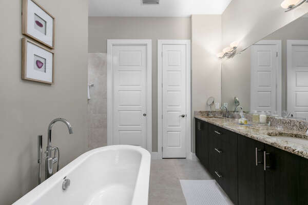 The ensuite bathroom is spacious and has a soaking tub and shower