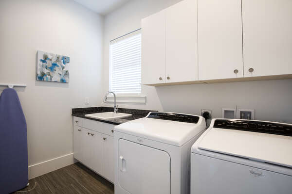 The home is complete with a wash room with full size washer and dryer