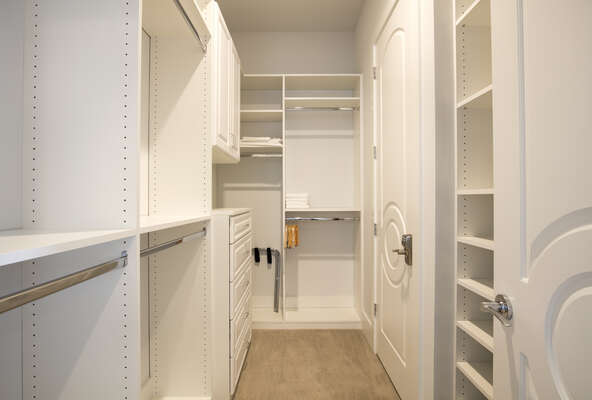 Spacious walk-in closet with built in shelfing