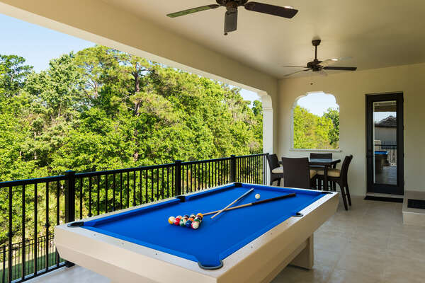 Play a game of pool and enjoy the view from the patio balcony with direct access to the game room