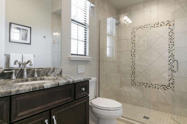 En-suite bathroom with glass door walk-in shower