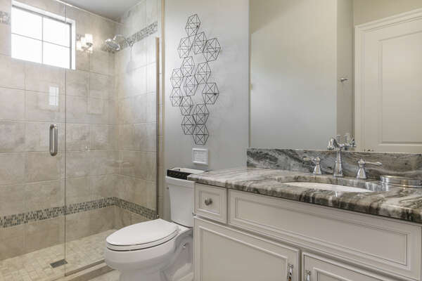 Master en-suite bathroom with glass door walk-in shower