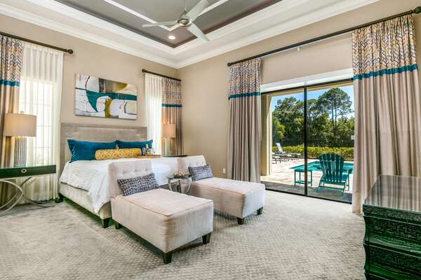 This master suite features king size bed, 65-inch SMART, en-suite bathroom, and access to pool area
