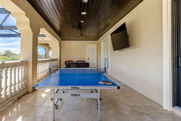 The second floor balcony has an 80 inch SMART TV and ping pong table