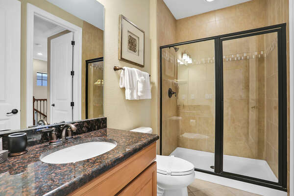 The family bathroom connects to the loft and 2 twin room. It includes a walk in shower