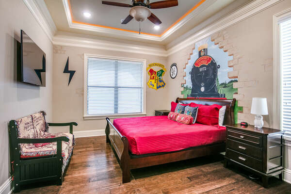 This bedroom features a King sized bed, snack bar with mini fridge, and an en-suite bathroom