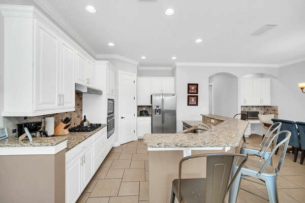 The kitchen offers plenty of space and also a walk in pantry
