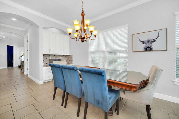 Stylish formal dining area comfortably seats eight