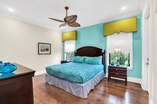 Enjoy this colorful second master bedroom with a King size bed