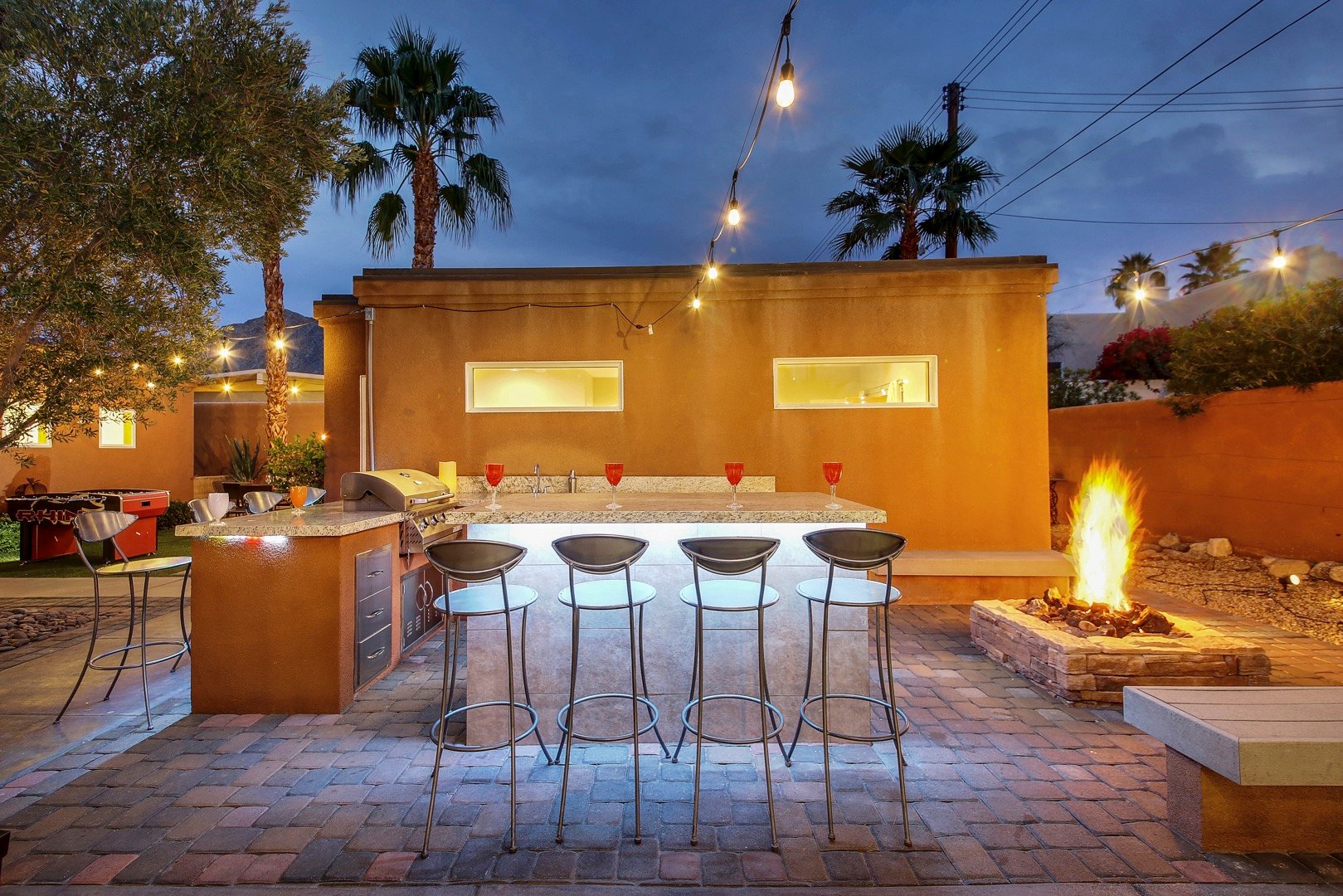 Have after dinner drinks on the built in Barbecue are featuring high top chairs for eight!
