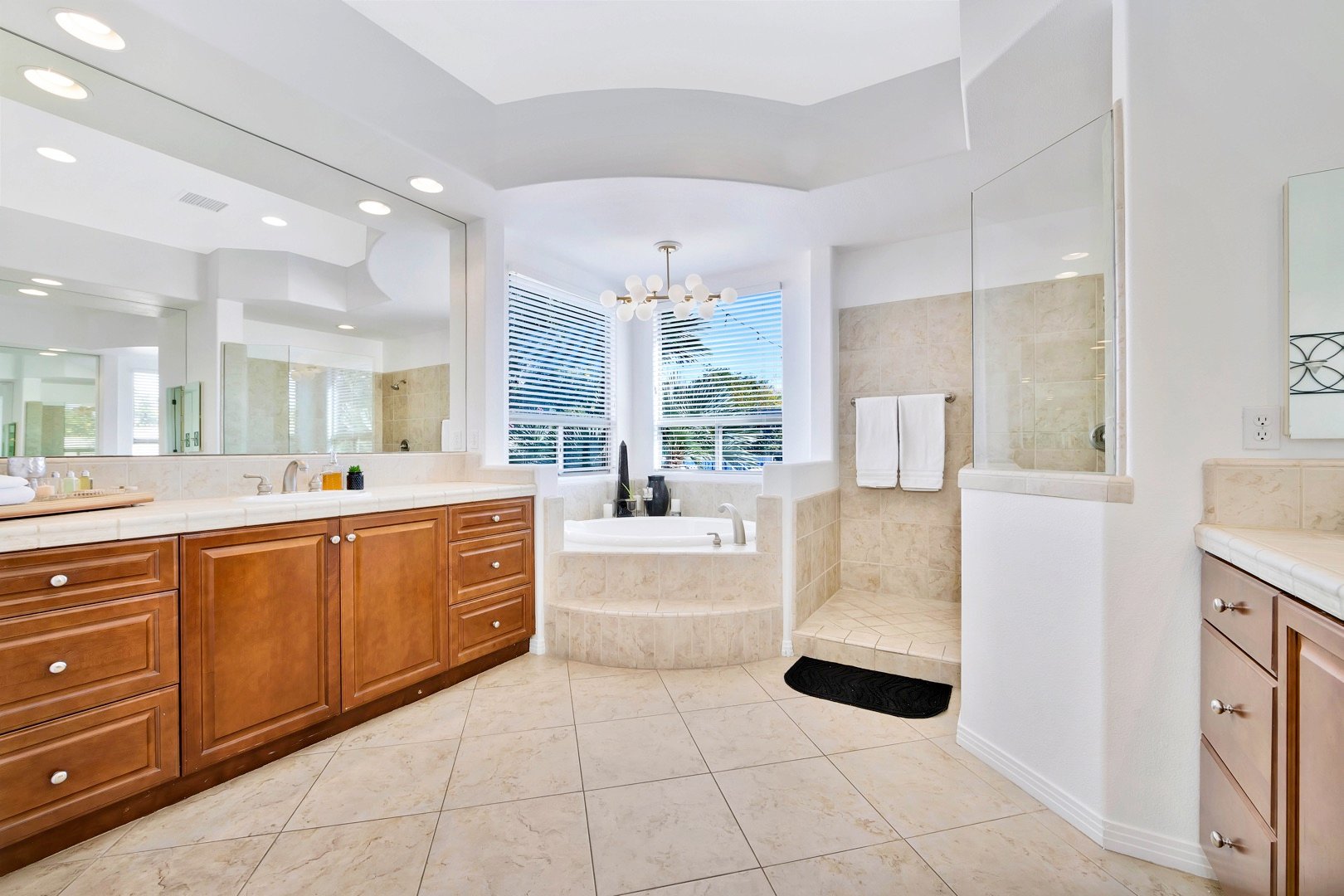 The master bathroom has his & hers vanity sinks, step in shower, and huge soaking tub.