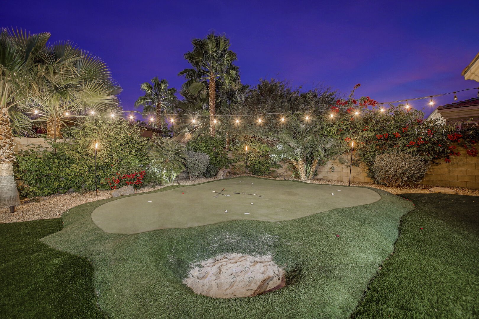 Show off your skills on the putting green! Putting green comes complete with a sand trap.