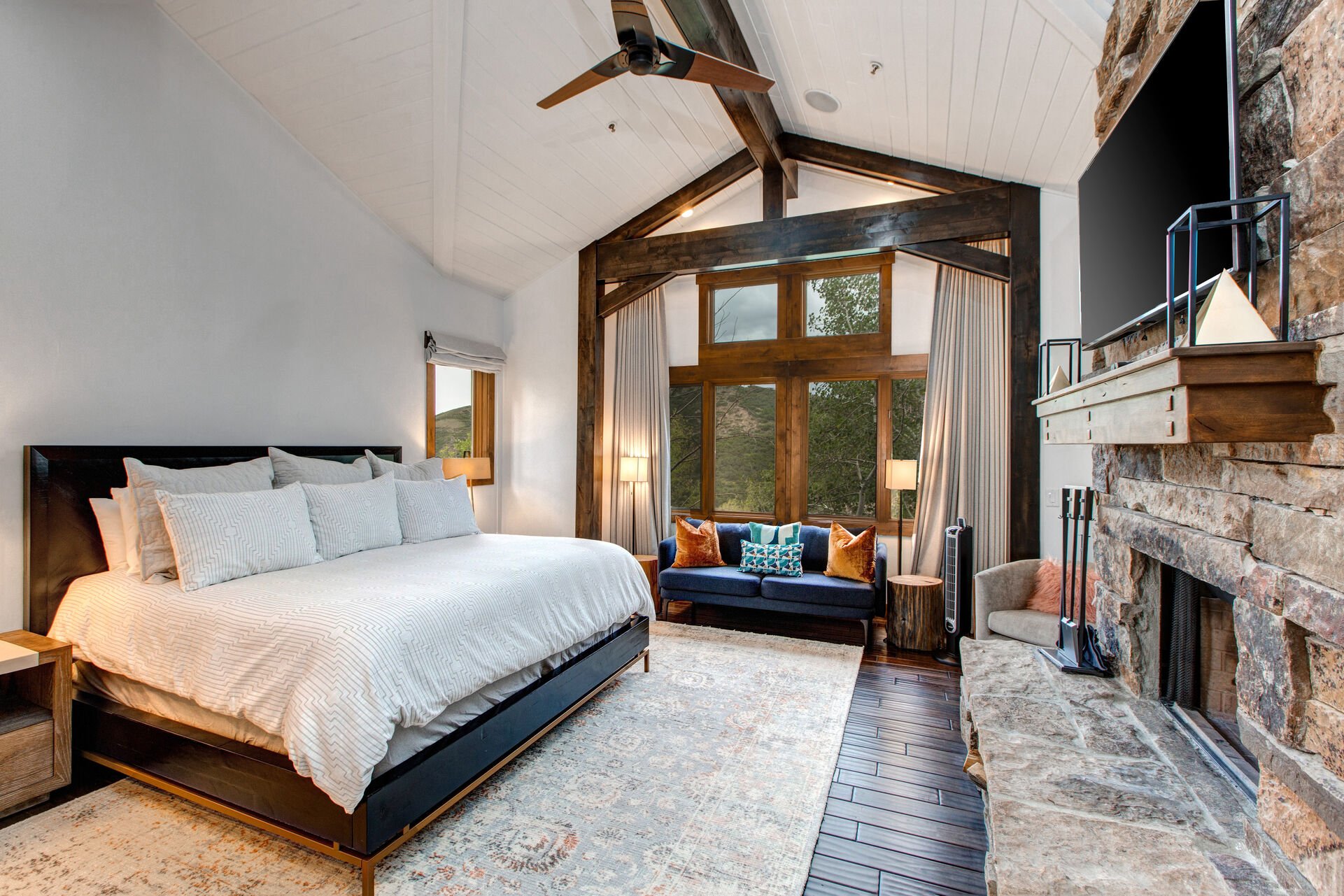Main Level Master Bedroom with a King Bed, Smart TV, and Deer Valley Views
