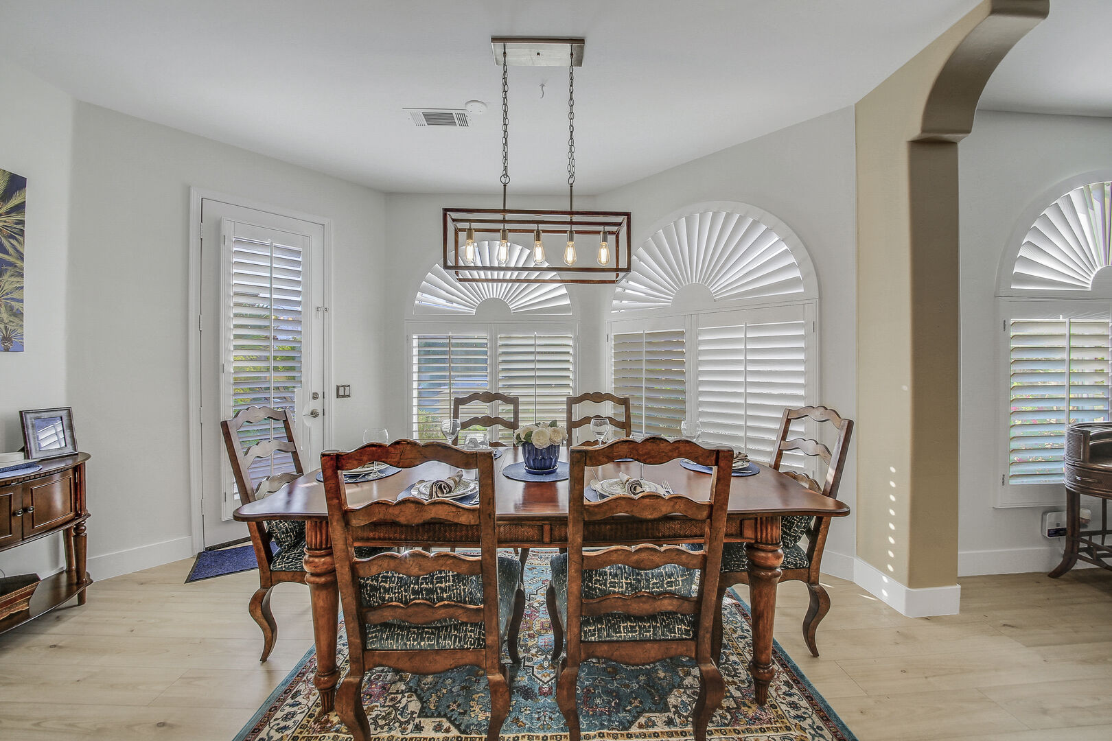 The casual dining area features a dining table with seating for six.