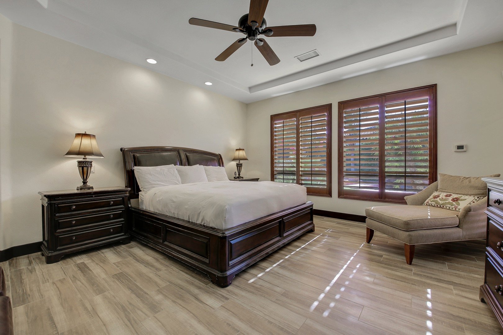 Master Suite 1 is located next to entrance doors and features a King-sized bed and Queen-sized sofa sleeper.