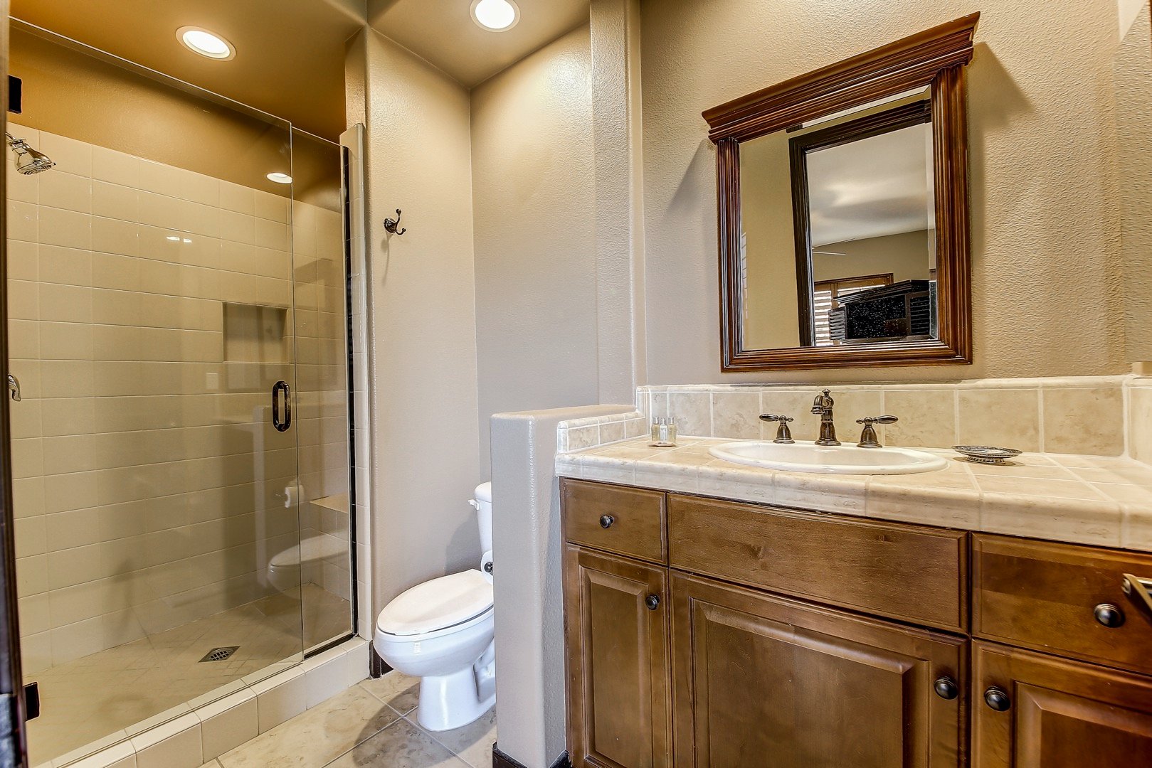 Casita Suite 2 bathroom features a tile shower and a vanity sink.