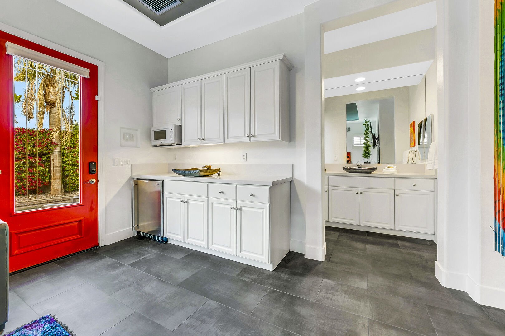 The casita kitchen area has an under-counter refrigerator including a high-capacity ice maker, microwave oven, sink and beautiful granite counter top.