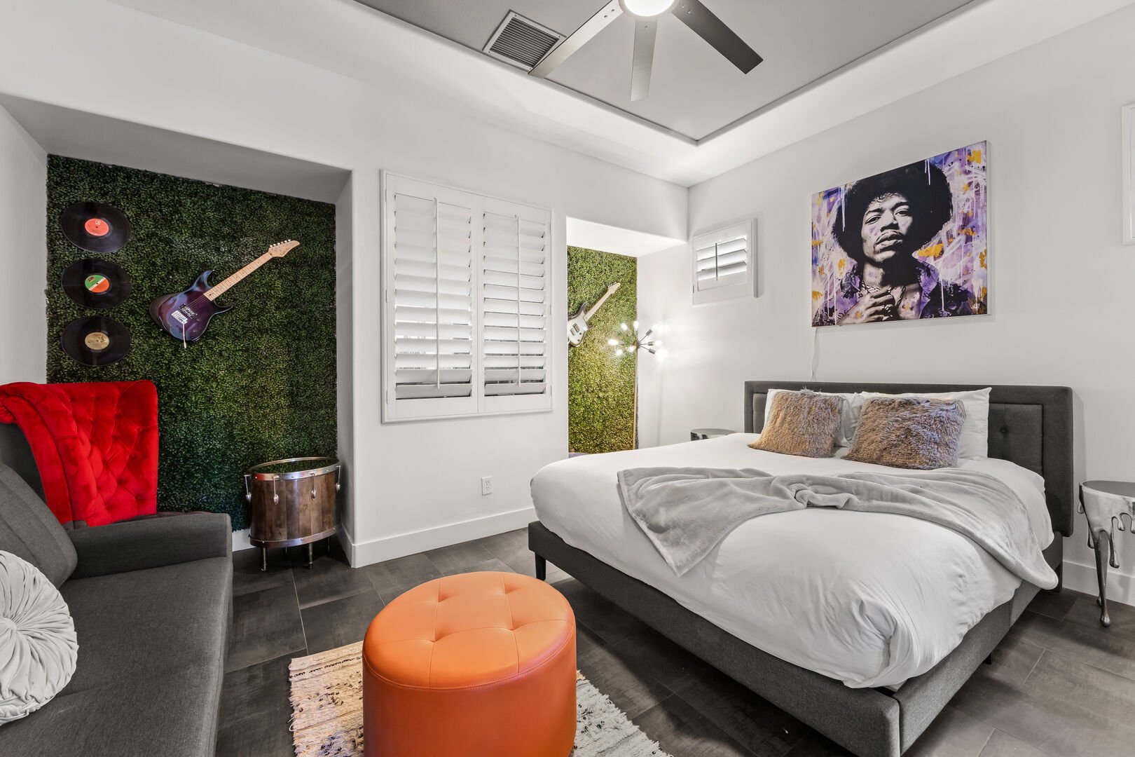 The separate Mega-Casita Suite 4 bedroom features a King-sized bed, Queen-sized sofa sleeper, double-sided gas fireplace, TV, and walk-in closet.