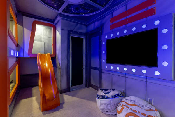 Spend all day playing in this galactic bedroom complete with a slide and your very own SMART TV