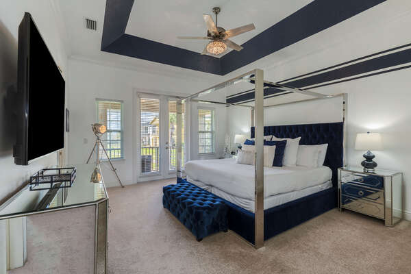 A luxurious master suite featuring a comfortable king sized bed