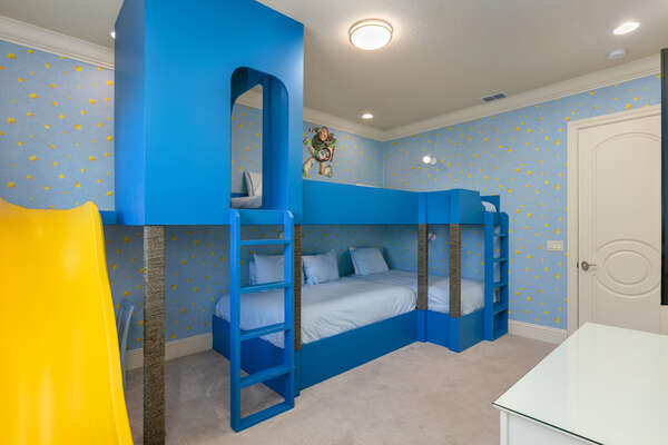 The room features two full beds and two twin beds for the little ones