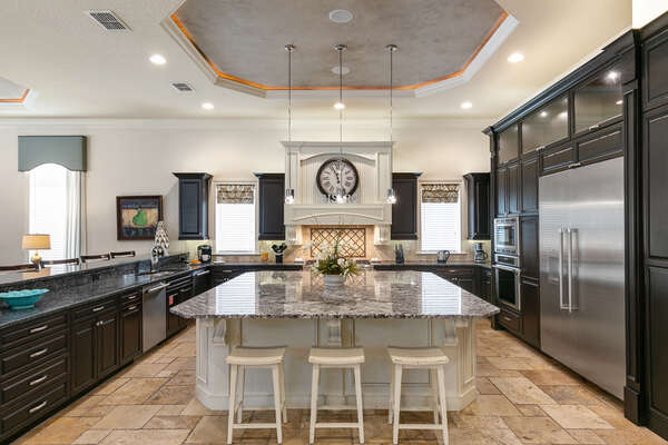 Spacious gourmet kitchen with large island offering more counter space