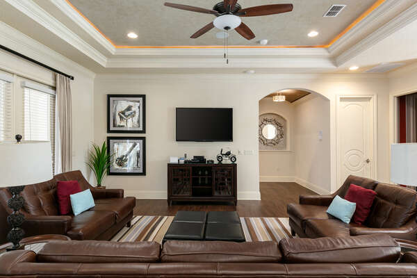 An additional gathering area with SMART TV and game console