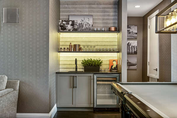 The wet bar is equipped for you to mix your favorite beverage