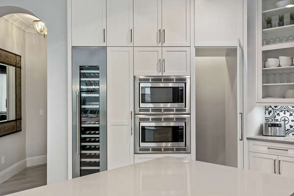 The kitchen features stainless steel appliances
